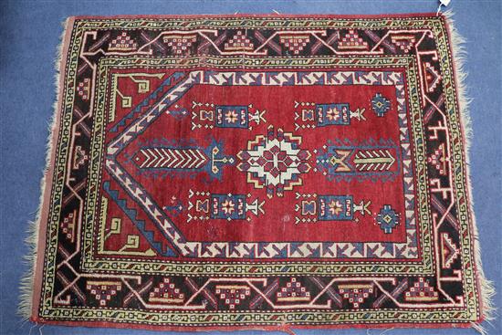A Turkish red ground prayer mat 130 x 100cm